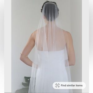 Pearl bridal veil. In original packaging. Details on length in pictures.
